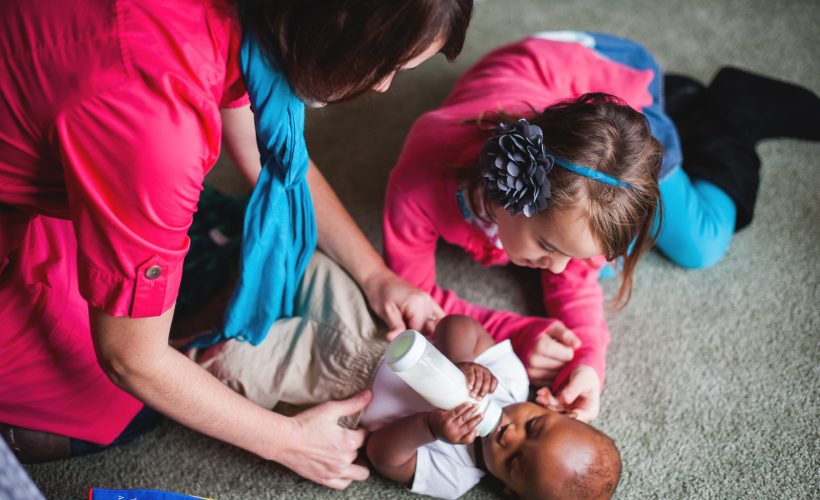 Mother, daughter, caring for baby by Alyssa and Drew Photography